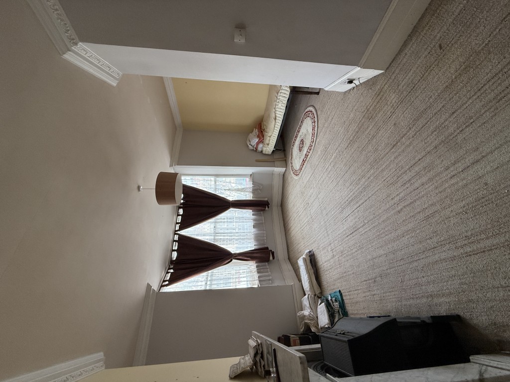 Lot: 82 - MIXED RESIDENTIAL AND COMMERCIAL BUILDING WITH POTENTIAL - Living room with large bay window